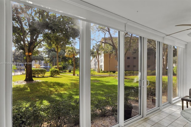 2301 Lucaya Ln Unit M1, Coconut Creek, FL 33066 - unfurnished sunroom with healthy amount of natural light, tile patterned flooring, and expansive windows