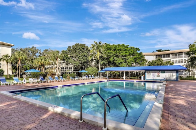 view of swimming pool featuring a patio area