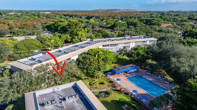 2301 Lucaya Ln Unit M1, Coconut Creek, FL 33066 - drone / aerial view of a forest and a pool