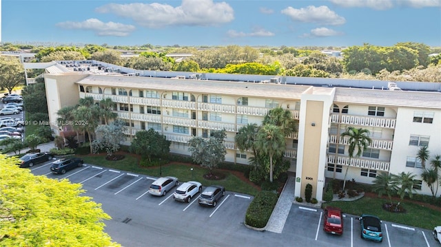 2301 Lucaya Ln Unit M1, Coconut Creek, FL 33066 - view of building exterior with uncovered parking