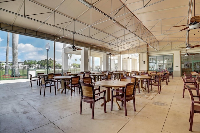 dining space featuring a wall of windows