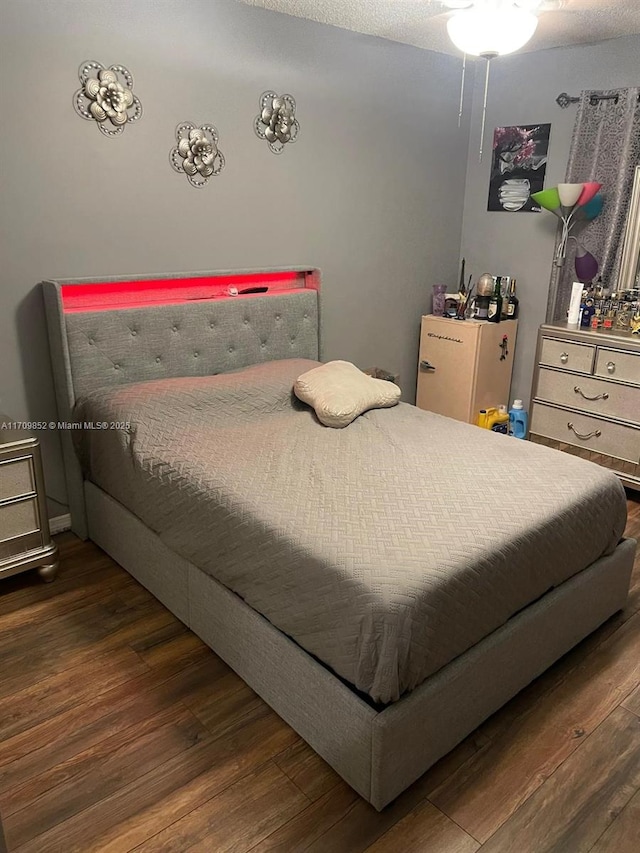 bedroom with wood finished floors