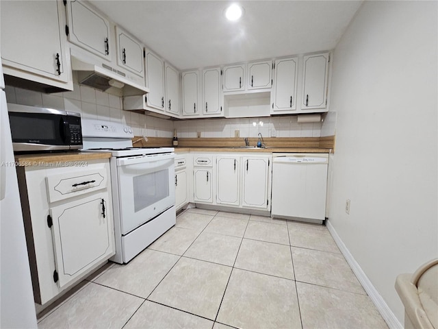 kitchen featuring decorative backsplash, white cabinetry, white appliances, and light tile patterned floors