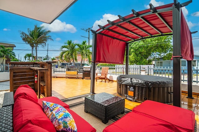 exterior space featuring a pergola, outdoor lounge area, grilling area, and a hot tub