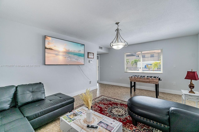 living room featuring a textured ceiling