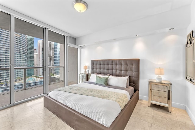 bedroom with access to exterior and light tile patterned floors