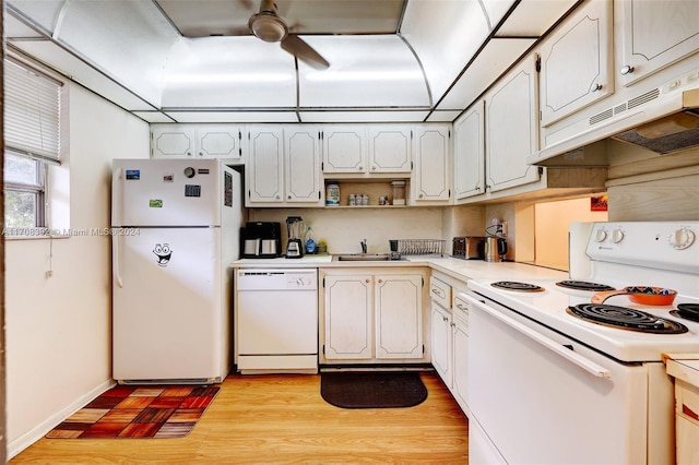 kitchen with light wood-type flooring, white appliances, white cabinetry, and sink