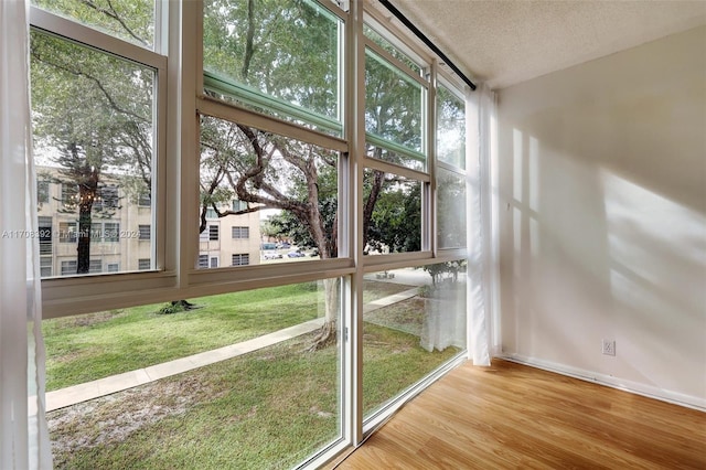 unfurnished sunroom with a wealth of natural light