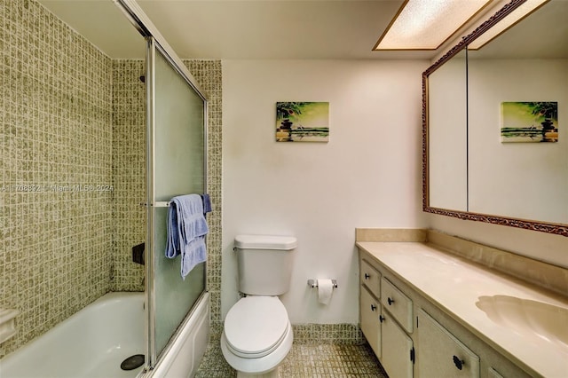 full bathroom with tile patterned floors, vanity, toilet, and enclosed tub / shower combo