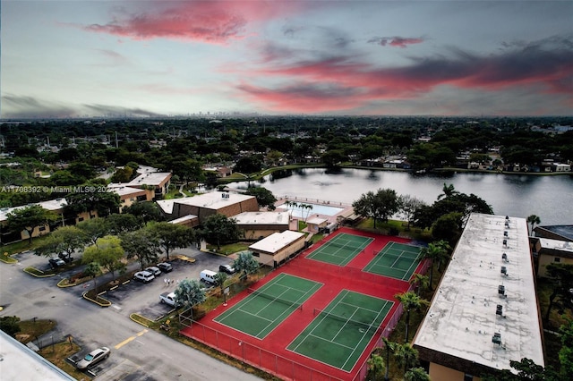 aerial view at dusk with a water view