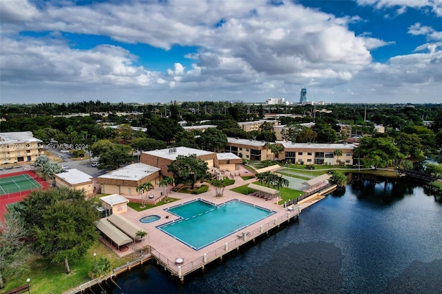 birds eye view of property with a water view