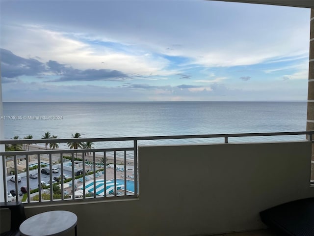 balcony featuring a water view