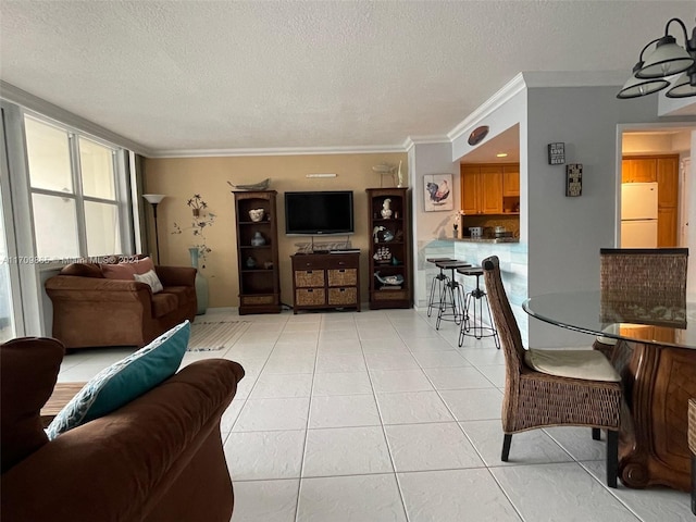 living room featuring a textured ceiling, crown molding, and light tile patterned flooring