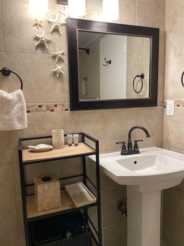 bathroom with decorative backsplash and tile walls