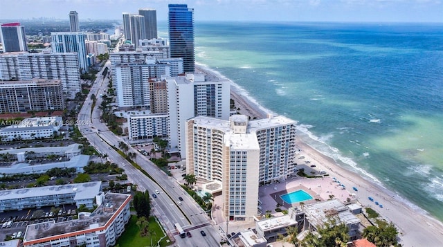 birds eye view of property featuring a view of the beach and a water view