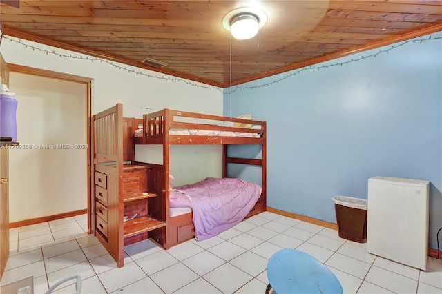 bedroom with light tile patterned floors and wood ceiling