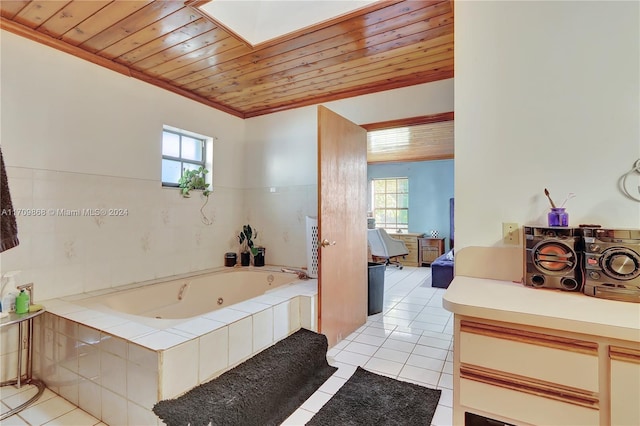 bathroom with tiled tub, crown molding, tile patterned flooring, and wooden ceiling