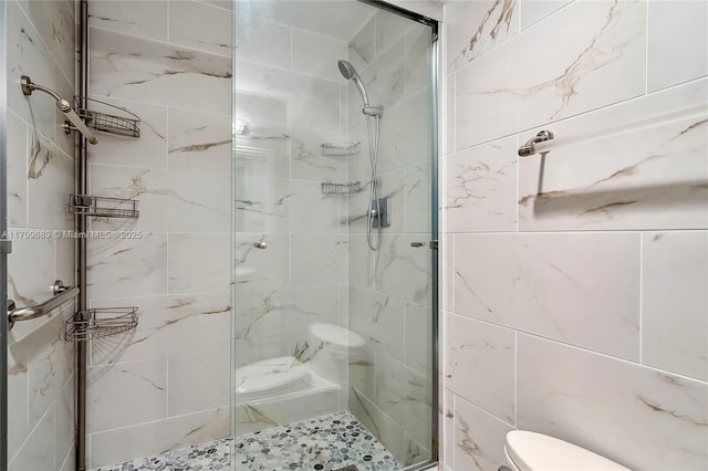 bathroom featuring an enclosed shower and toilet