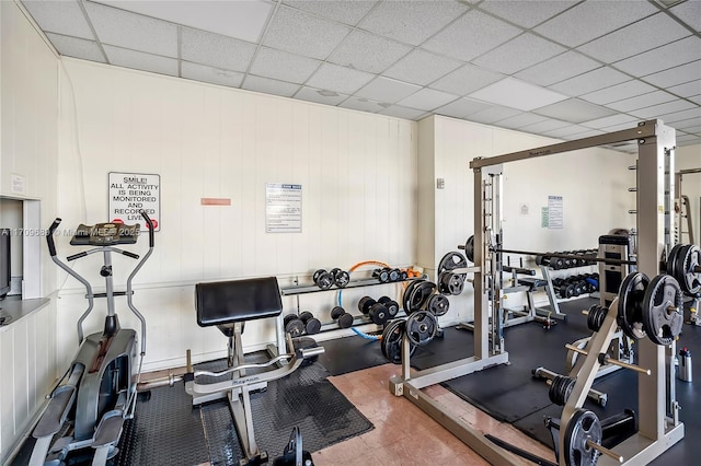 workout area with a paneled ceiling