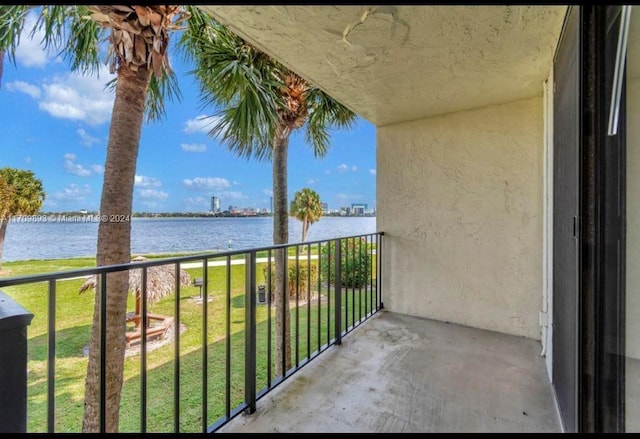 balcony featuring a water view