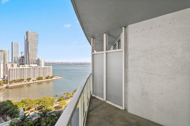 balcony featuring a water view