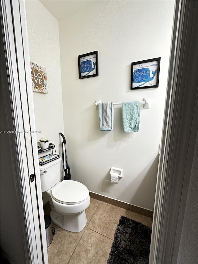 bathroom featuring tile patterned flooring and toilet