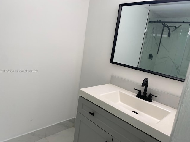 bathroom with vanity and a shower with shower door