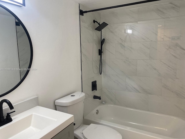 full bathroom featuring vanity, toilet, and tiled shower / bath