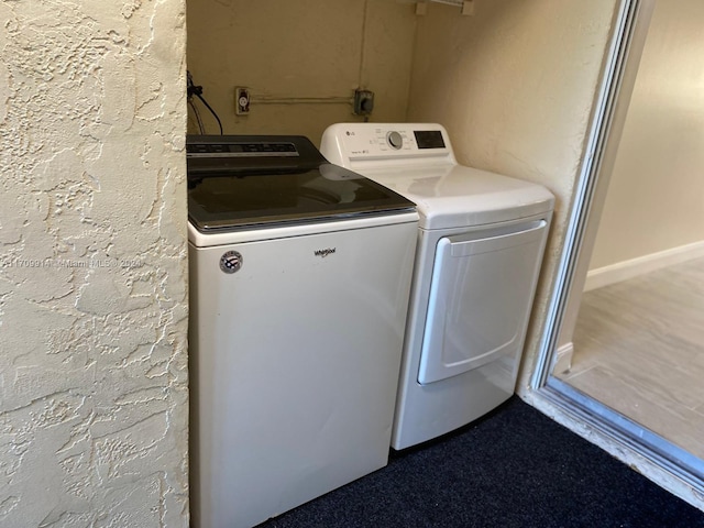 laundry area with washing machine and clothes dryer