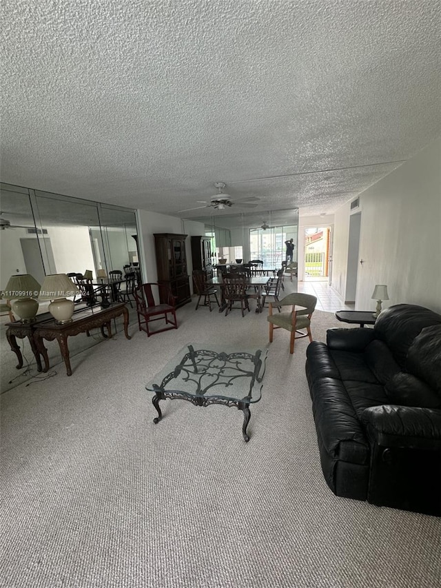 living room featuring a textured ceiling and carpet floors