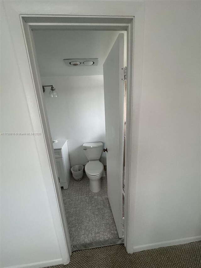 bathroom featuring tile patterned floors and toilet