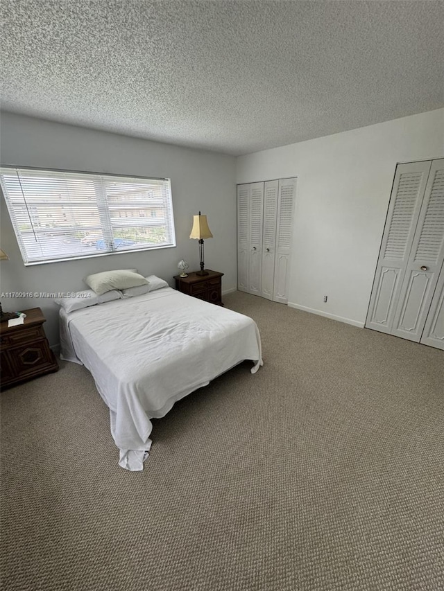 carpeted bedroom with a textured ceiling