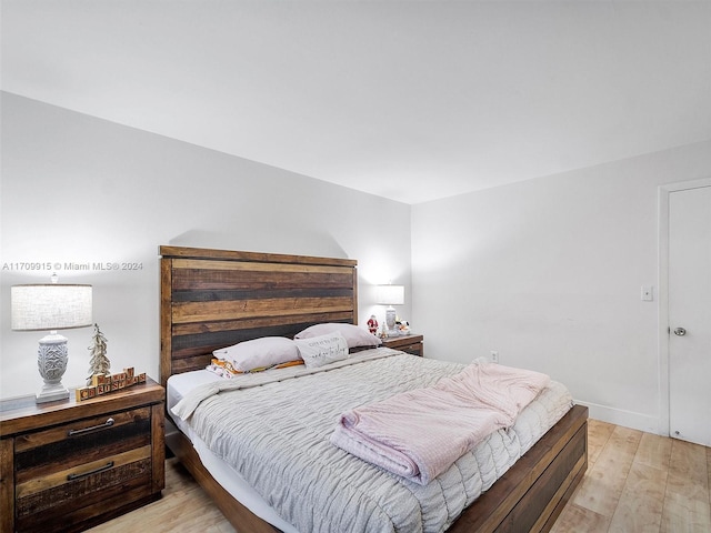 bedroom with light hardwood / wood-style floors