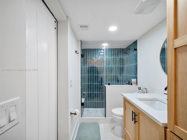 bathroom with tile patterned floors, vanity, toilet, and an enclosed shower