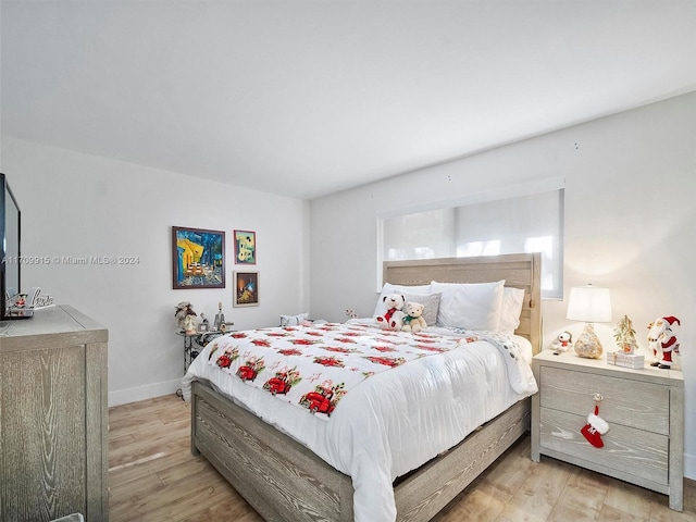 bedroom with light hardwood / wood-style floors