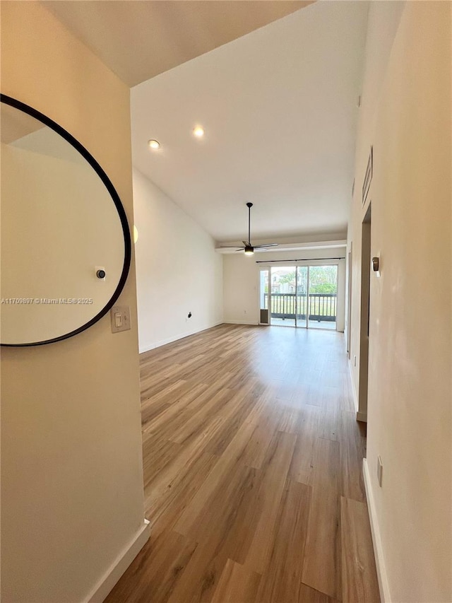 interior space with ceiling fan and light hardwood / wood-style floors