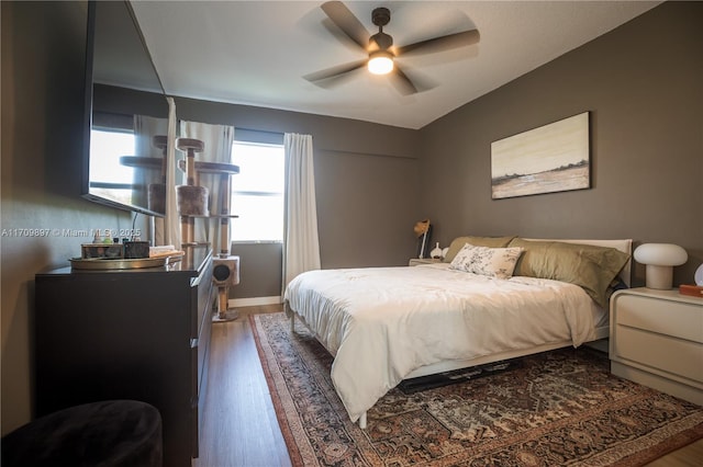 bedroom with dark wood-type flooring and ceiling fan