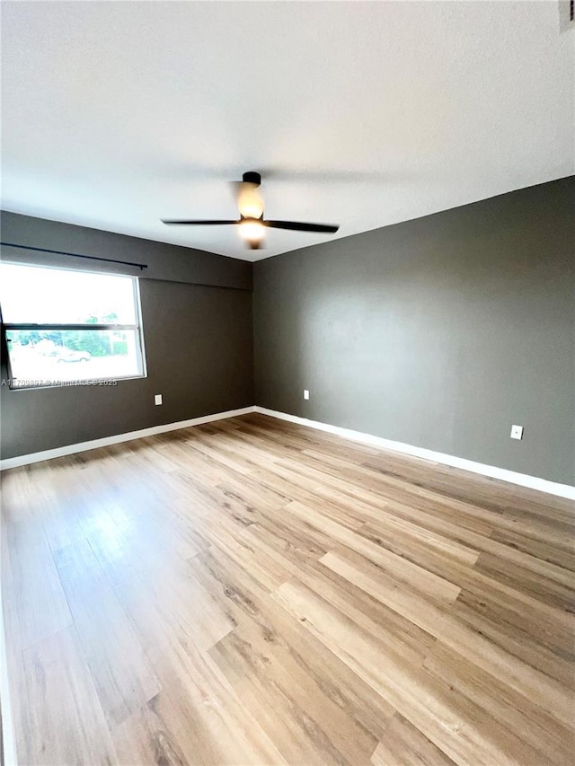 unfurnished room with light hardwood / wood-style floors and ceiling fan