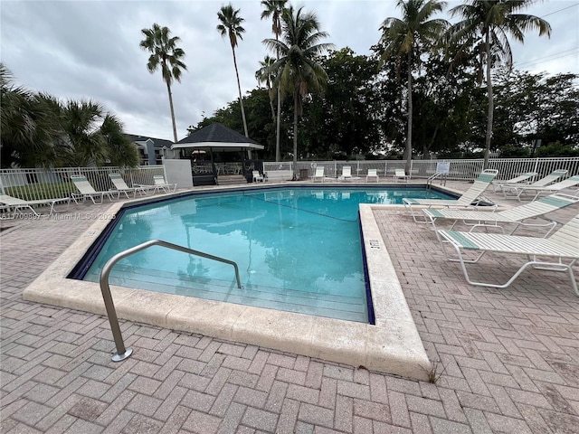 view of swimming pool featuring a gazebo and a patio area