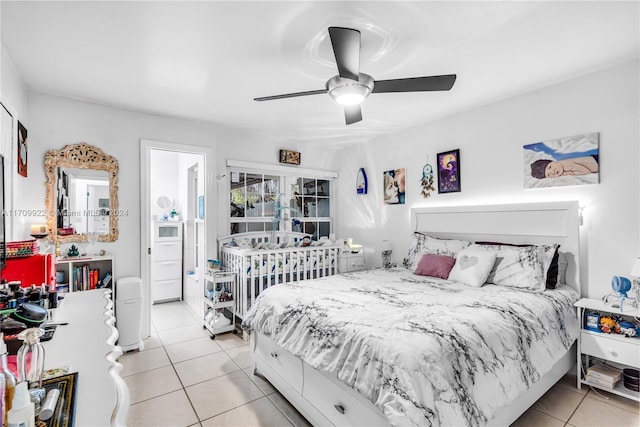 tiled bedroom with ceiling fan