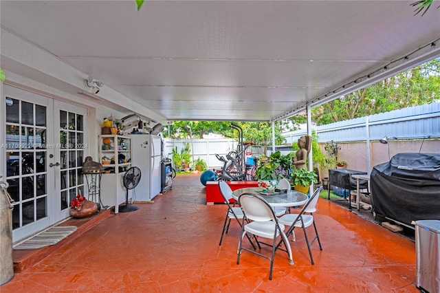 view of patio with a grill and french doors