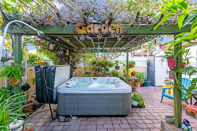 view of patio featuring a pergola, a gazebo, and a hot tub