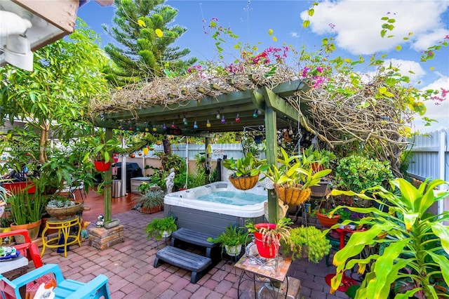 view of patio / terrace with a hot tub