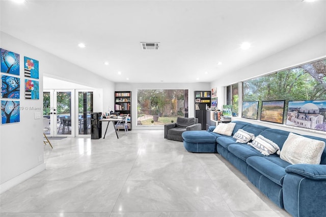 living room with plenty of natural light and french doors