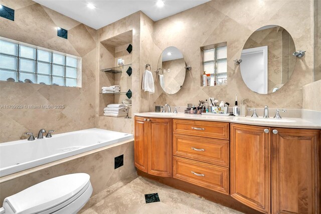 bathroom with decorative backsplash, vanity, a shower with door, and tile walls