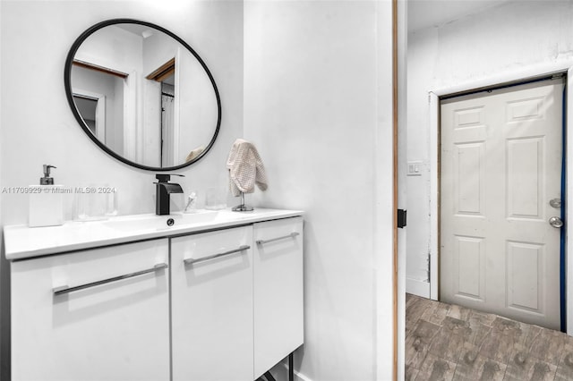 bathroom featuring hardwood / wood-style floors and vanity