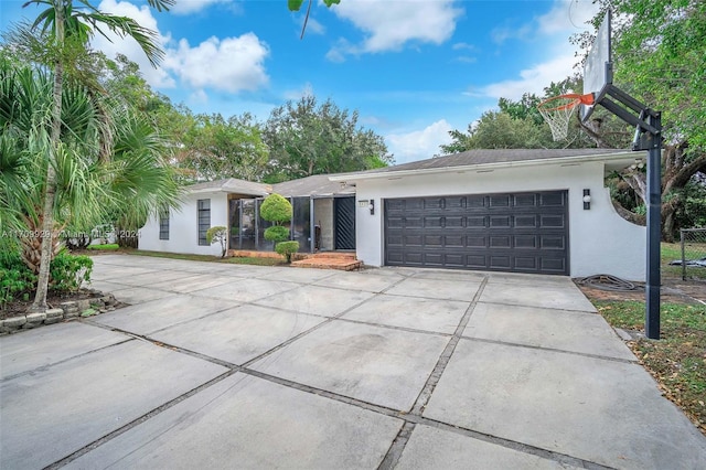 ranch-style home featuring a garage