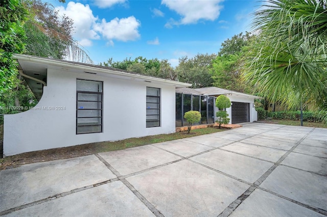 view of property exterior with a garage