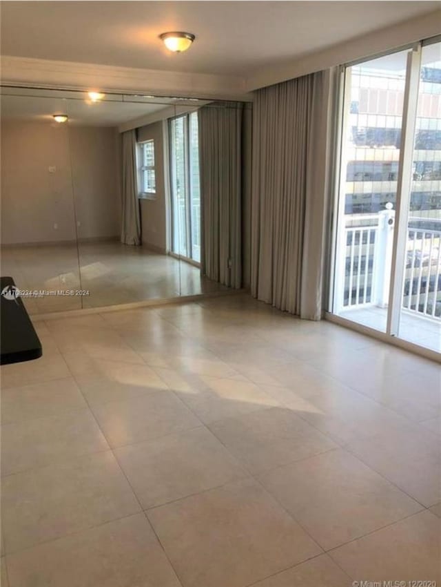 185 SE 14th Ter Unit 1809, Miami, FL 33131 - spare room featuring light tile patterned flooring