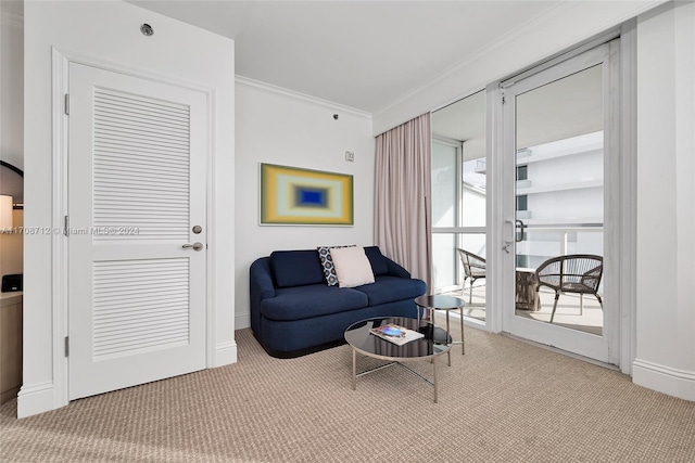 carpeted living room with plenty of natural light and ornamental molding